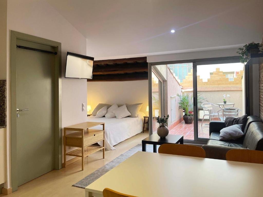 Salón y dormitorio del SF con salida a la terraza